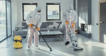 Two Workers sucking water with advanced equipment